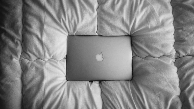 laptop on bed