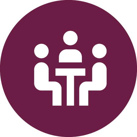 Figures around a desk