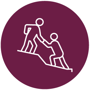 Person helping another person up a hill.